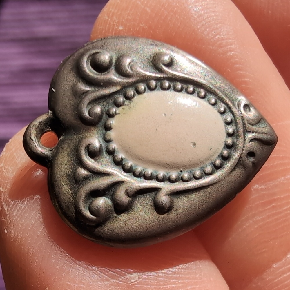 Antique sterling silver puffed heart charm